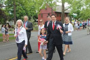 Jon and Olivia marching in the Memorial Day parade.